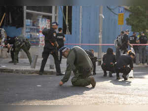 Israeli police investigate the scene of an explosive drone attack in Tel Aviv, I...