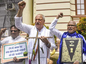 Patna: Congress MLAs stage a protest outside the Bihar Assembly during the state...
