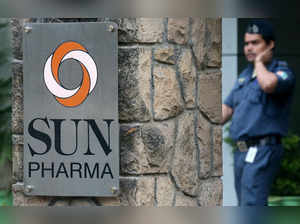 FILE PHOTO: A guard walks inside the office of Sun Pharmaceutical Industries Ltd in Mumbai