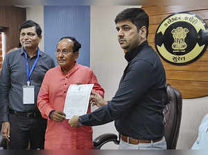 Surat: BJP leader Mukesh Dalal receives the 'certificate of election' after he w...