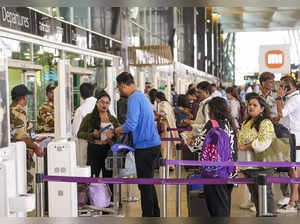 Bengaluru: Passengers in queue at the Kempegowda International Airport Bengaluru...