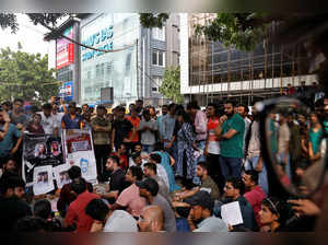 Demonstrators attend a protest outside a coaching centre in New Delhi