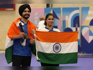 India's Manu Bhaker, right, and Sarabjot Singh celebrate after winning the bronz...