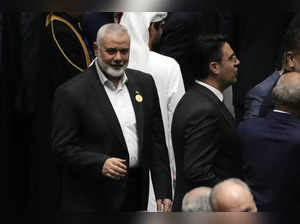 Hamas chief Ismail Haniyeh arrives at the Iranian parliament to attend the swear...
