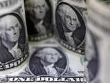 Dollar gains on geopolitical tensions, pound slips after rate cut