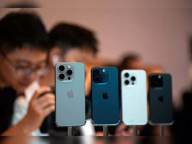 People look at the new iPhone 15 Pro as Apple's new iPhone 15 officially goes on sale across China at an Apple store in Shanghai