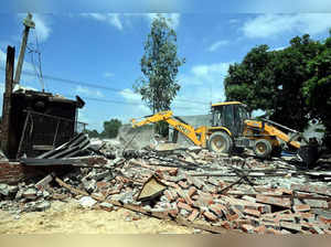 Ayodhya: A bulldozer being used to demolish the bakery of Moid Khan who is accus...
