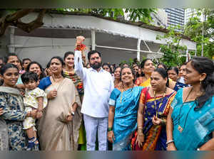 Women tie rakhi to Mahrashtra CM Eknath Shinde after the l...
