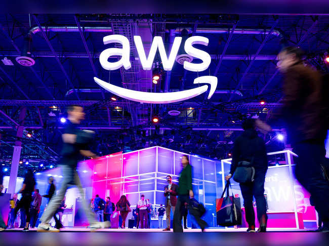 Attendees walk through an expo hall at AWS re:Invent 2023, a conference hosted by Amazon Web Services (AWS), in Las Vegas