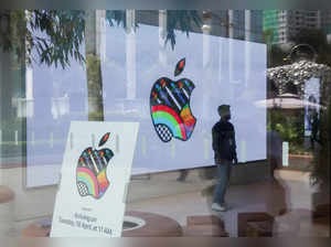 FILE PHOTO: Man stands inside India's first Apple retail store during a media preview, a day ahead of its launch, in Mumbai