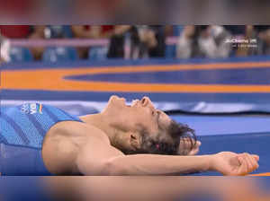 Wrestler Vinesh Phogat cries after beating Japan's Yui Susaki in Olympics women's 50 kg freestyle wrestling.
