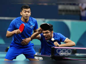 India's Manav Vikash Thakkar, foreground, and Harmeet Desai play against China's...