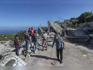 Hezbollah fighters shoot down an Israeli drone in Lebanon and fire rockets at an Israeli base