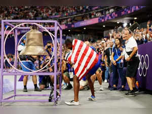 Why are athletes ringing the bell installed at the Stade de France 2024 after winning a medal?