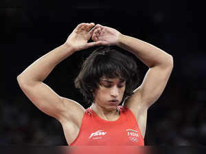 India's Vinesh Phogat during the women's freestyle 50kg quarterfinal wrestling m...