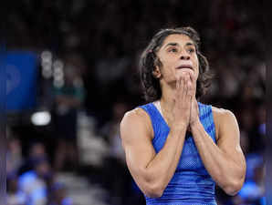 India's Vinesh Phogat reacts after the round of 16 of the women's freestyle 50kg...