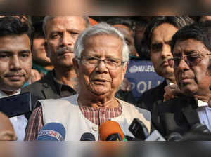 Dhaka : (FILE) - Bangladeshi Nobel Peace Prize laureate Muhammad Yunus (C) talks...