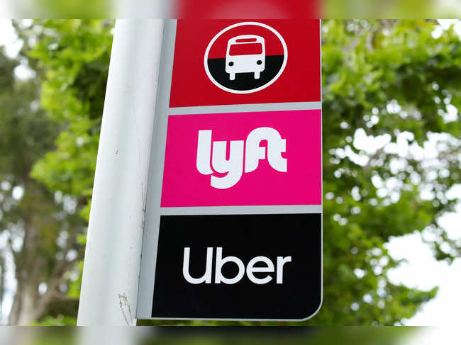 FILE PHOTO: A sign marks a rendezvous location for Lyft and Uber users at San Diego State University in San Diego