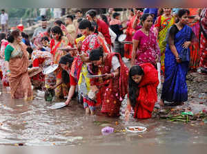 Bangladeshi Hindu devotees release oil lamps to the Buriganga river as they observe Bipodtarini or Bipodnashini puja in Dhaka