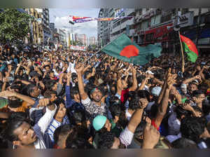 People gather in front of the Bangladesh Nationalist Party (BNP) headquarters du...