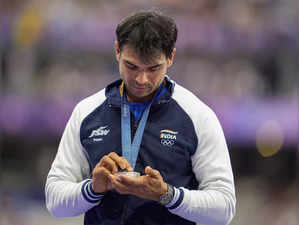 Silver medalist India’s Neeraj Chopra at the podium during the victory ce...