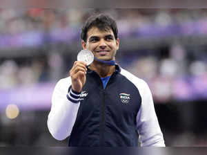 Men's javelin silver medalist, Neeraj Chopra, of India, stands on the podium at ...