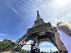 Police arrest a man climbing the Eiffel Tower, prompting an evacuation hours before closing ceremony