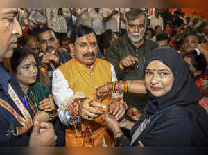 Bhopal: Madhya Pradesh Chief Minister Mohan Yadav with women during Rani Durgava...