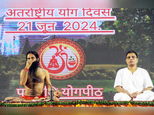 Haridwar, Jun 21 (ANI): Yog guru Baba Ramdev and Patanjali Ayurved's Managing Di...