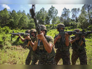 Rajouri: Indian Army soldiers keep a watch near the Line of Control (LOC) ahead ...