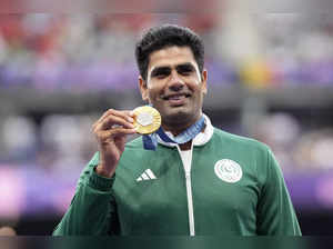 Men's javelin gold medalist, Arshad Nadeem, of Pakistan, waves on the podium at ...