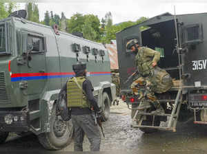 Anantnag: Army personnel during an encounter with terrorists at Ahlan Gagarmandu...