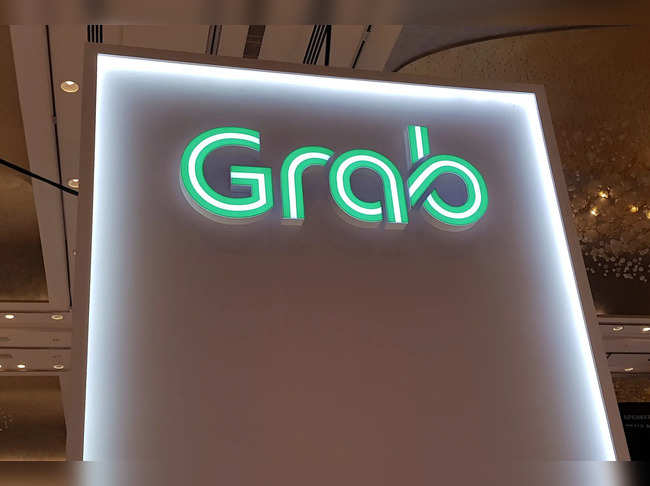 A Grab logo is pictured at the Money 20/20 Asia Fintech Trade Show in Singapore