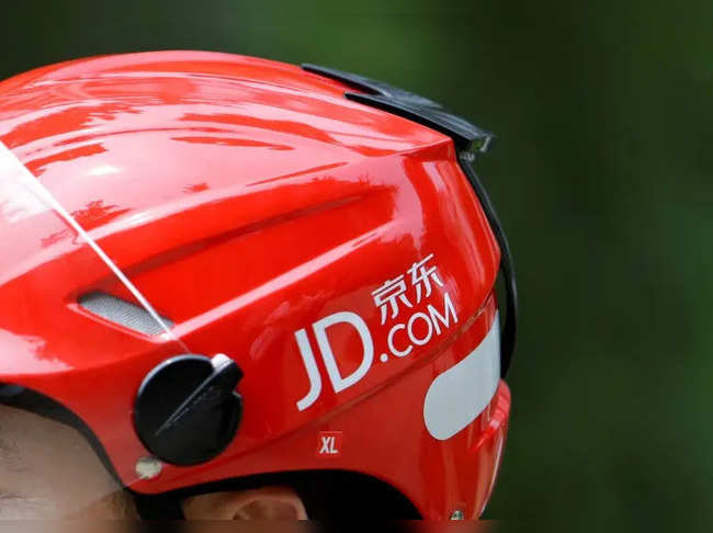 FILE PHOTO: Logo of JD.com is seen on a helmet of a delivery man in Beijing