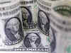 Dollar holds gains on reassuring data, euro slips