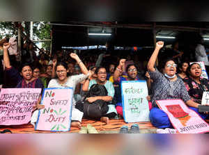 Kolkata: Doctors shout slogans during a protest against sexual assault and killi...