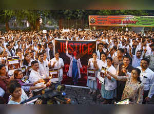 Nagpur: Doctors take part in a candle march to condemn the rape and killing of a...