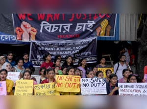 Doctors and nursing staff protest against the recent the rape and murder of a woman doctor