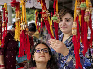 Amritsar: Women shop ‘rakhi’ ahead of ‘Raksha Bandhan’ festival, in Amritsar. (P...