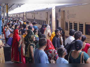 Mathura: People board a train at Mathura Cantt railway station on the occasion o...