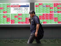 Japan's Nikkei rebounds on softer yen, tech gains