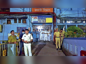 Cops stand guard on the campus of RG Kar hospital