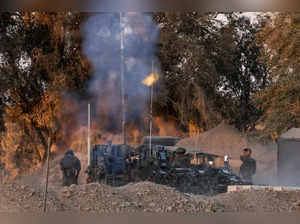 Israeli soldiers fire mortars towards Gaza, near the Israel-Gaza border