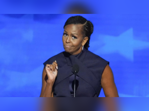 Michelle Obama at DNC says her parents were 'suspicious' of the wealthy but wears dress that costs nearly $3000