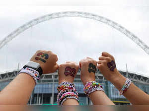 FILE PHOTO: Fans gather for Taylor Swift's concert at Wembley Stadium, in London