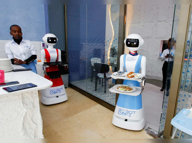 A Robotic technology server moves to deliver a meal at the Robot Cafe, the food hub featuring robots that serves customers in Nairobi