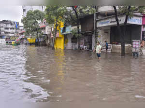 Surat:: A waterlogged road at Ved Darwaja after heavy rainfall, in Surat, Tuesda...