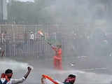 Watch: Saffron-clad elderly man holding national flag faces water cannons at 'Nabanna Abhijan' protest in Kolkata