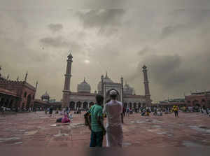 New Delhi: Monsoon clouds hover in the sky above the Jama Masjid, in New Delhi. ...