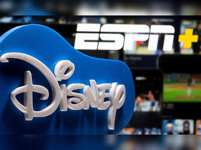 FILE PHOTO: Photo illustration of a 3D printed Disney logo seen in front of the ESPN+ logo